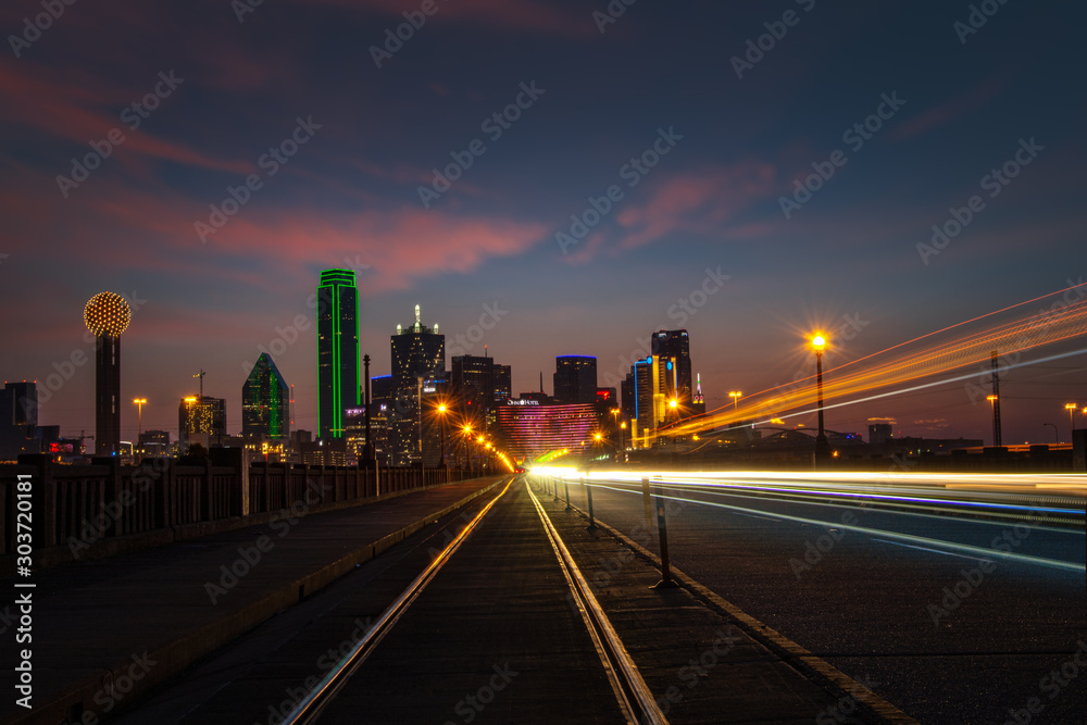 Dallas Texas. Long exposure with streaking car and train lights and clouds Dallas Texas. Long exposure with streaking car and train lights and clouds