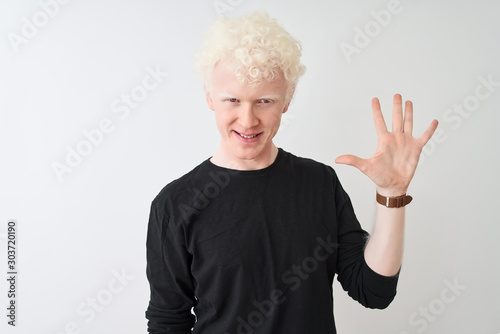 Young albino blond man wearing black t-shirt standing over isolated white background showing and pointing up with fingers number five while smiling confident and happy.