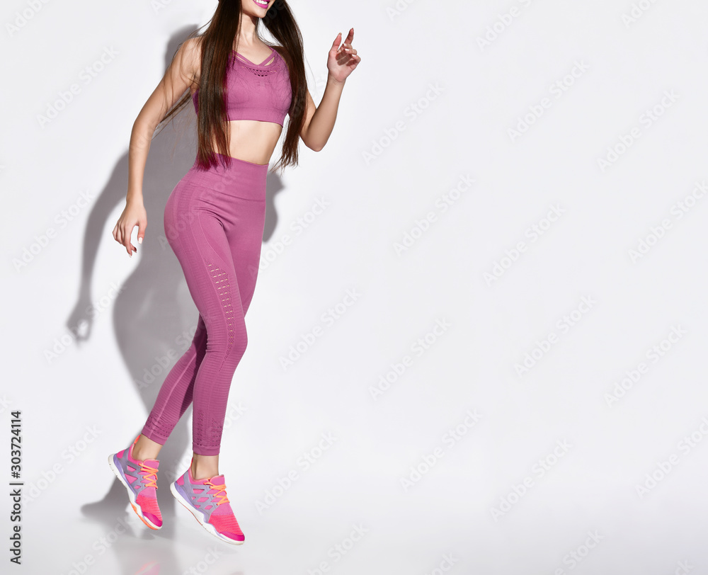Beautiful young jogging woman. Isolated over white background.