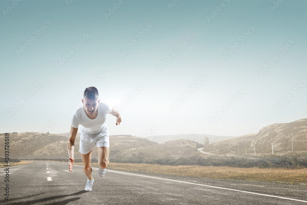Obraz premium Athlete man running race. Mixed media