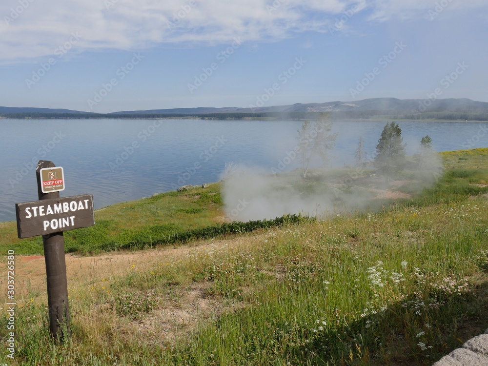Yellowstone Lake with steaming geysers at the Steamboat Point, Yellowstone National Park, Wyoming.