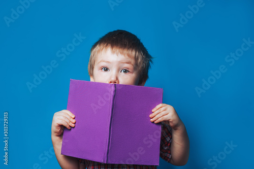 Young thin woman playing with red gamepad, sitting on yellow background. flat lay.