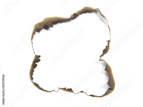 Collection of burnt holes in a piece of paper isolated on white background. Fire holes in white paper.