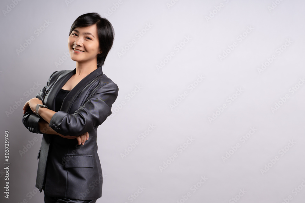 Portrait of a confident woman standing isolated over background Portrait of a confident woman standing isolated over background