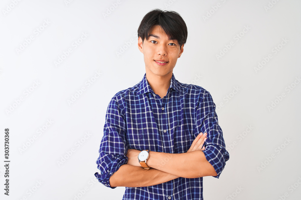 Young chinese man wearing casual blue shirt standing over isolated white background happy face smiling with crossed arms looking at the camera. Positive person. Young chinese man wearing casual blue shirt standing over isolated white background happy face smiling with crossed arms looking at the camera. Positive person.