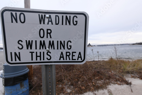 No wading or swimming in this area sign © Jameson