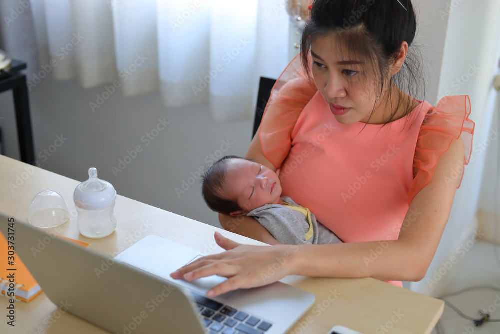 mother parenting a baby newborn sleeping in home office, businesswoman typing keyboard laptop computer of woman working freelance business mother parenting a baby newborn sleeping in home office, businesswoman typing keyboard laptop computer of woman working freelance business