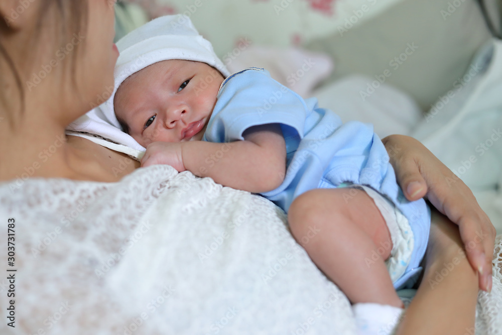 little newborn baby embracing on mother with love