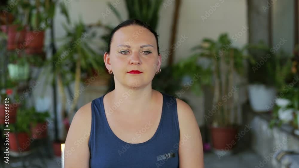 A young woman does exercises with eyes moving square. A young woman does exercises with eyes moving square.