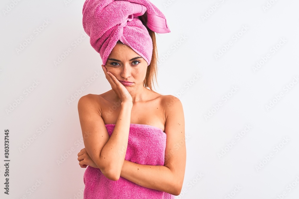Young beautiful woman wearing shower towel after bath over isolated white background thinking looking tired and bored with depression problems with crossed arms. Young beautiful woman wearing shower towel after bath over isolated white background thinking looking tired and bored with depression problems with crossed arms.