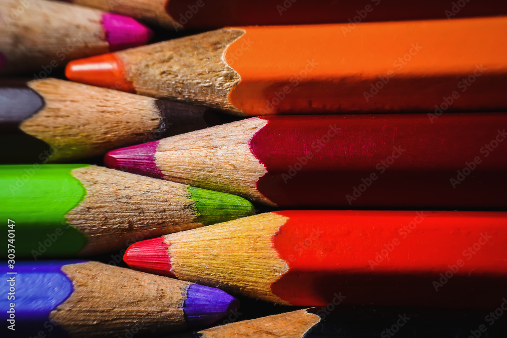 Many wooden crayons that have been used in the dark background are macro images. Many wooden crayons that have been used in the dark background are macro images.