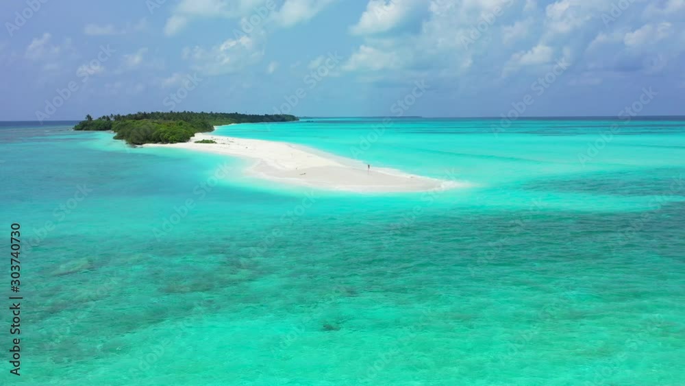 Bright turquoise lagoon with crystal emerald water surrounding idyllic tiny tropical island with long white beach in Dominican Republic Bright turquoise lagoon with crystal emerald water surrounding idyllic tiny tropical island with long white beach in Dominican Republic