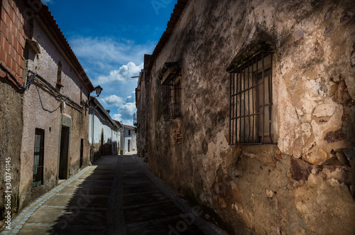 Zafra  Spain - Apr 2 2019  Typical spanish   andalusian village street  with ancient charming houses  Andalusia  Spain  Europe  blue sky