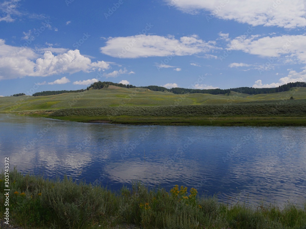 Medium shot of a scenic landscape with the Yellowstone River at Yellowstone National Park in Wyoming, USA.