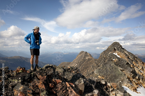 Young adventure healthy man is hiking Geraldine Lakes trail in Jasper National park,  Alberta, Canada. Solo traveling backpacker photo