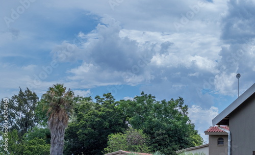 Summer thunder storm clouds build up over a residential neighbourhood in Gauteng Highveld in South Africa image with copy space in horizontal format photo