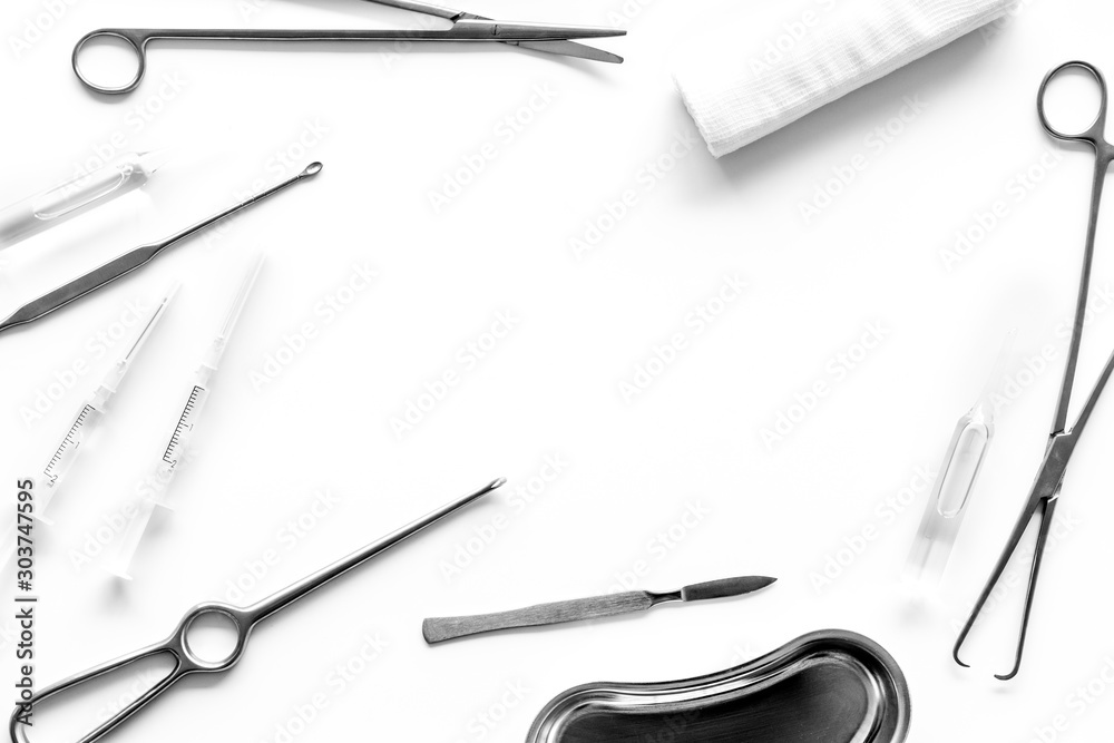 Plastic surgery. Instruments for beauty operations on white background top view frame copy space Plastic surgery. Instruments for beauty operations on white background top view frame copy space
