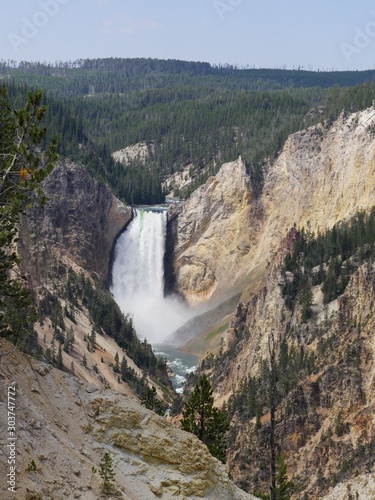 Portrait medium wide view of the Lower Yellowstone Falls seen from the Artist Point at the Yellowstone National Park in Wyoming.