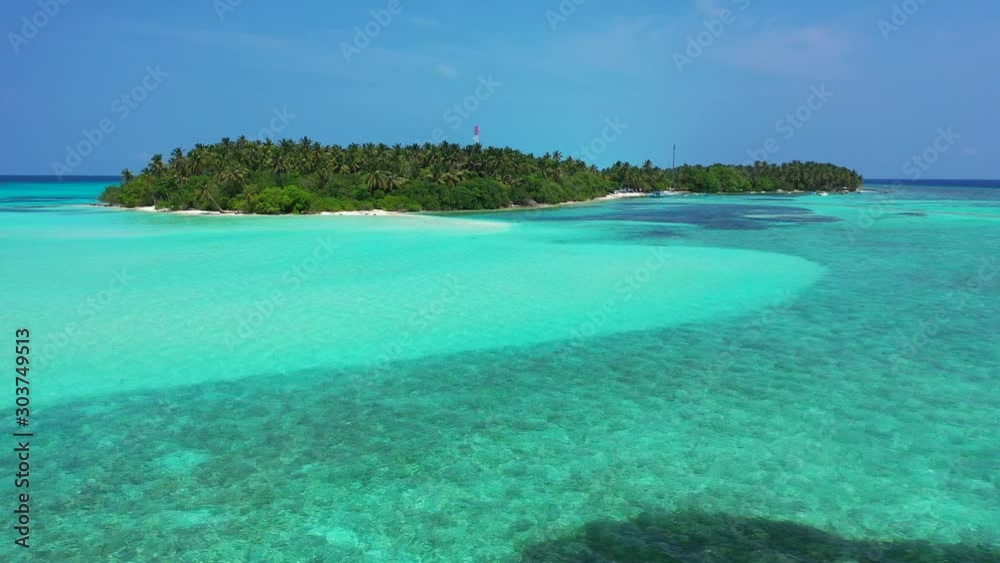 Crystal emerald water of turquoise lagoon around tropical islands with white beaches and palm trees forest in Hawaii Crystal emerald water of turquoise lagoon around tropical islands with white beaches and palm trees forest in Hawaii