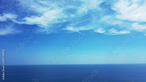 Wallpaper Mural Peaceful heaven scenery with beautiful clouds hanging on light blue sky over endless deep blue Atlantic ocean, copy space Torontodigital.ca