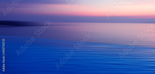 Blurred background of refraction in water © opasstudio