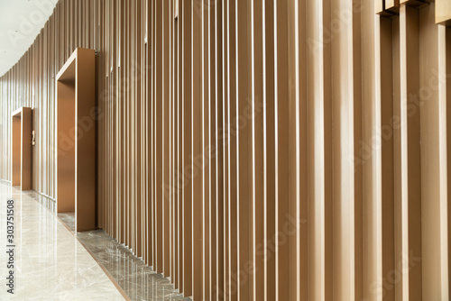 Detail of Random wooden strip wall in vertical direction at pre-function space / interior / natural light © Nut