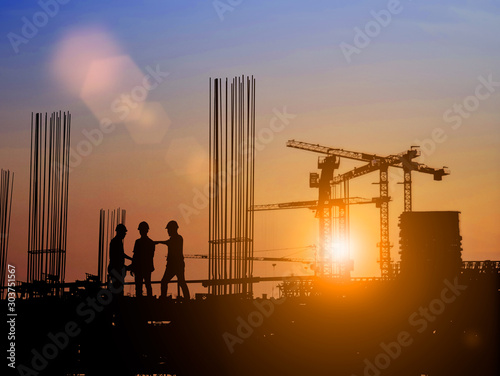 Silhouette of Survey Engineer and construction team working at site over blurred industry background with Light fair Film Grain effect.Create from multiple reference images together