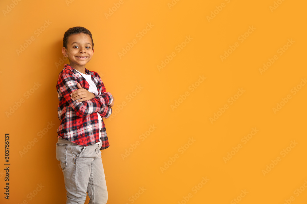 Fashionable African-American boy on color background Fashionable African-American boy on color background