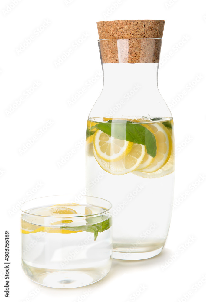 Bottle and glass of fresh lemonade on white background Bottle and glass of fresh lemonade on white background