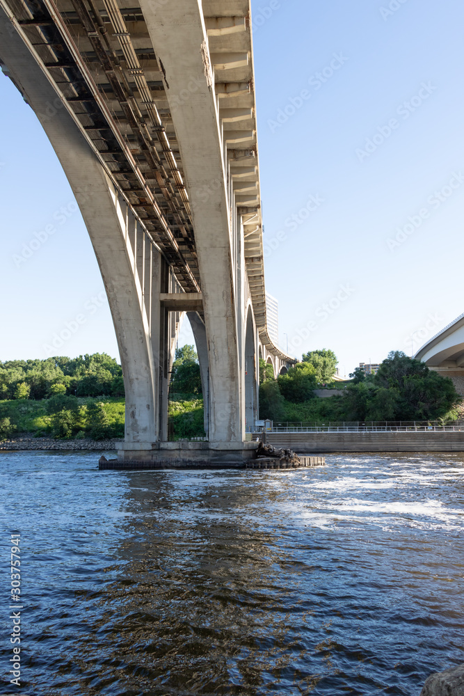 Fototapeta premium Bridge over river viewed from beneath