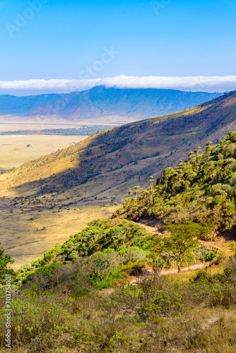 Panorama of Ngorongoro crater National Park with the Lake Magadi. Safari Tours in Savannah of Africa. Beautiful landscape scenery in Tanzania, Africa photo