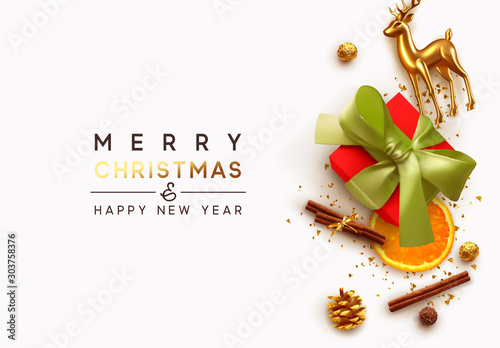 Merry Christmas and Happy New Year. Xmas composition realistic design elements, gift box, cinnamon, orange slice, chocolates, gold glass reindeer, metal deer. Holiday banner, poster, greeting card.