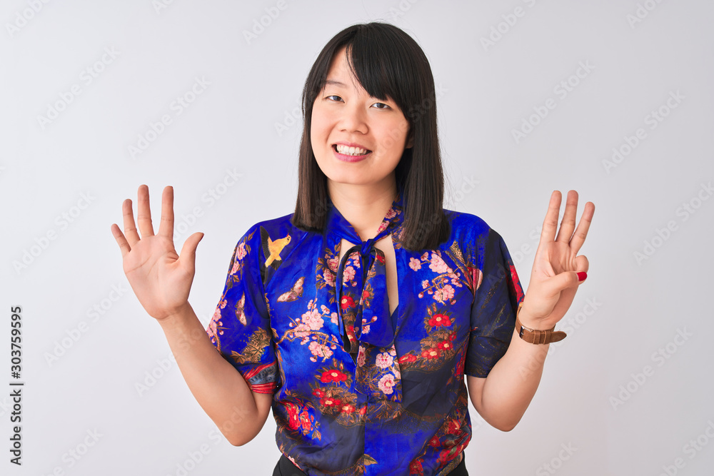 Young beautiful chinese woman wearing summer floral t-shirt over isolated white background showing and pointing up with fingers number eight while smiling confident and happy. Young beautiful chinese woman wearing summer floral t-shirt over isolated white background showing and pointing up with fingers number eight while smiling confident and happy.
