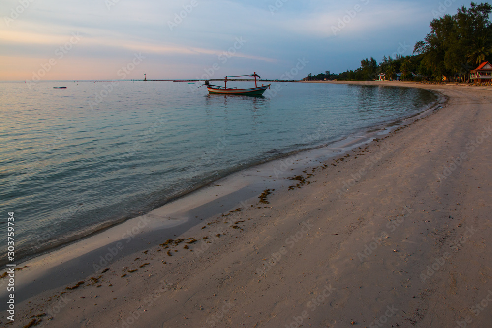 Fishermen boat at sunset near Koh Phangan island, Thailand Fishermen boat at sunset near Koh Phangan island, Thailand