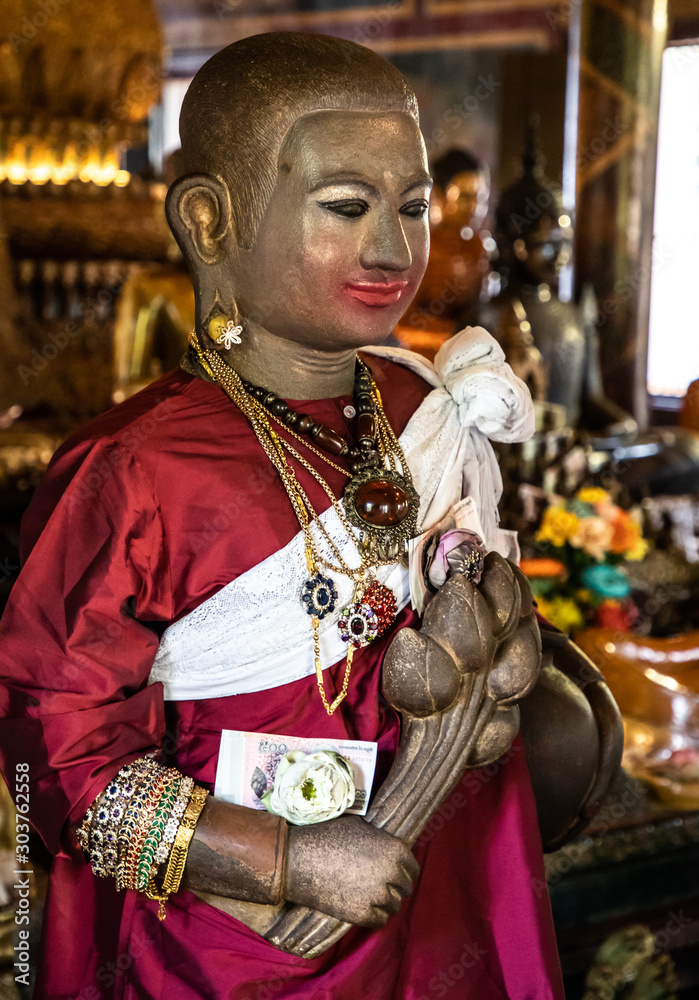 Buddha statue inside Wat Phnom, Phnom Penh, Cambodia