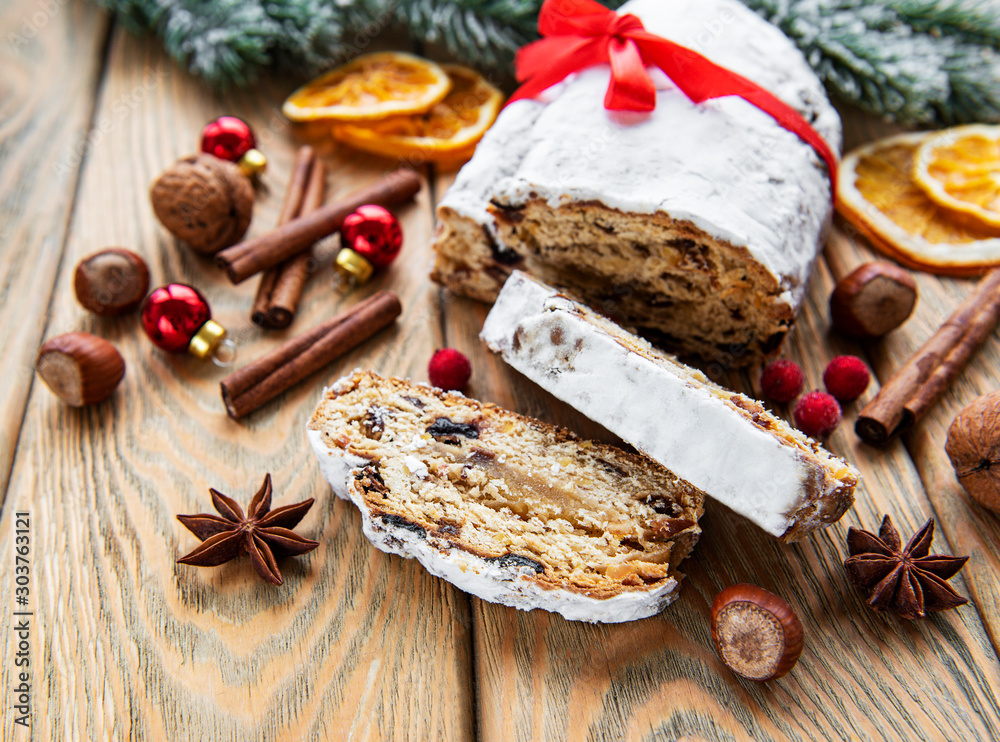Fototapeta premium Christmas stollen on wooden background