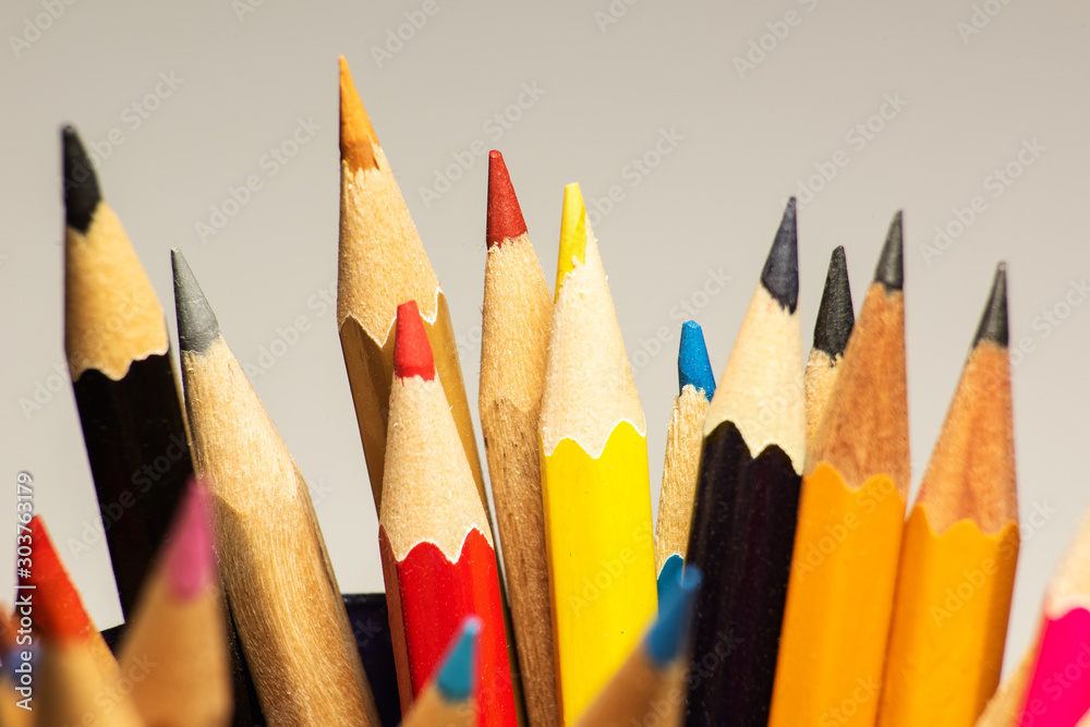 Background with multi-colored wooden pencils, soft focus Background with multi-colored wooden pencils, soft focus