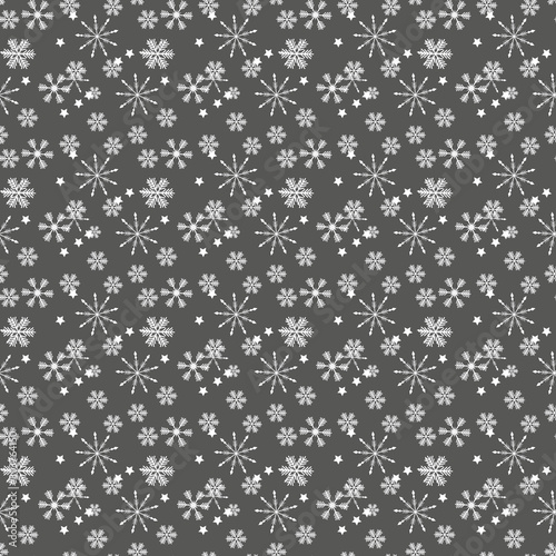 Christmas seamless pattern of complex big and small snowflakes in white colors on gray background