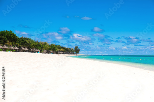Fototapeta Naklejka Na Ścianę i Meble -  Tropical holiday beach with ocean, white sand, palm