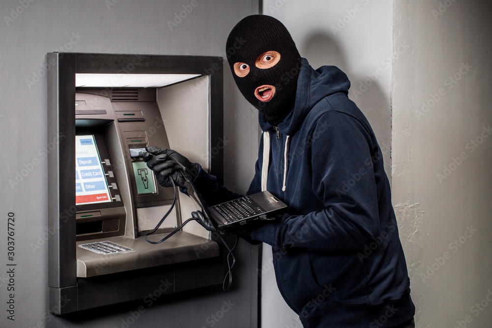 Hacker stealing password and identity on atm machine. Computer crime concept. Hacker stealing password and identity on atm machine. Computer crime concept.