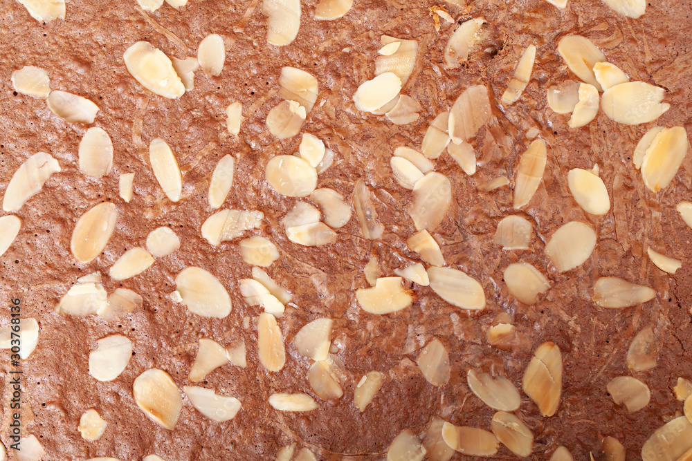 Background of fresh bake chocolate brownie and sliced almond Background of fresh bake chocolate brownie and sliced almond