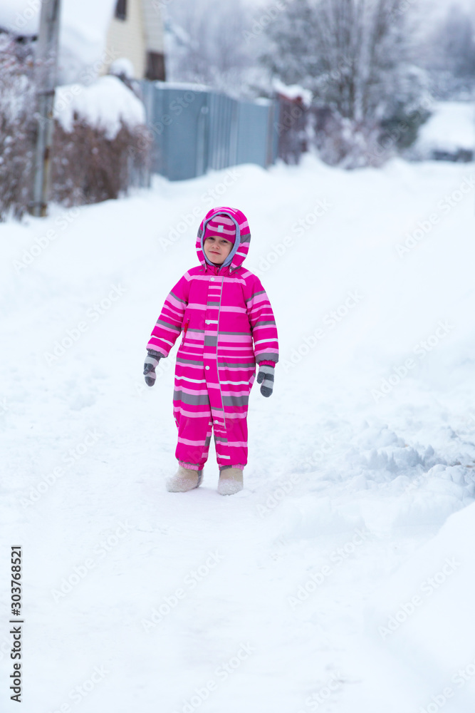 Girl playing outside in winter