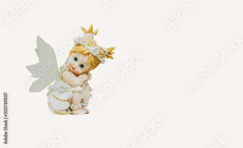 The cupid statue of a child on a white background