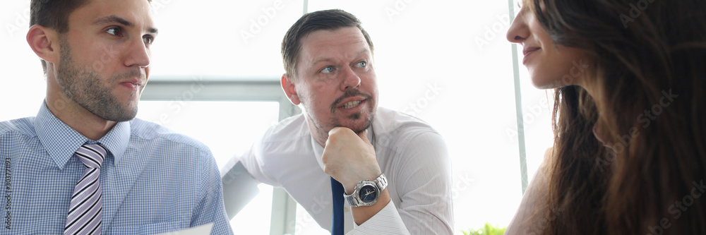 Φωτογραφία Portrait of attractive businesswoman sitting with smiling colleagues