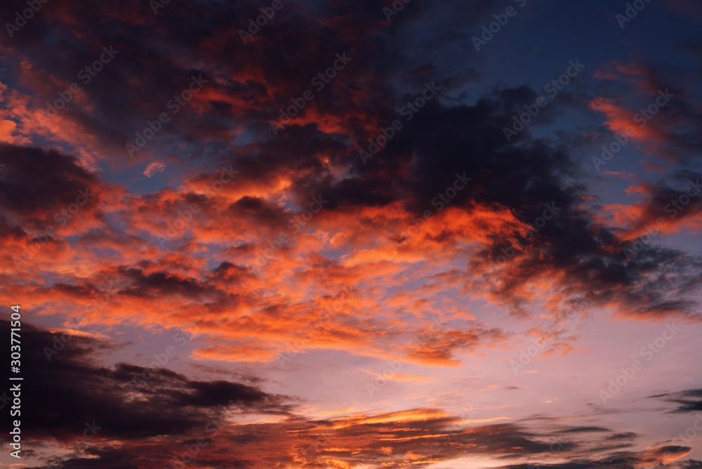 Beautiful clouds with colorful sky during idyllic sunset on the evening.