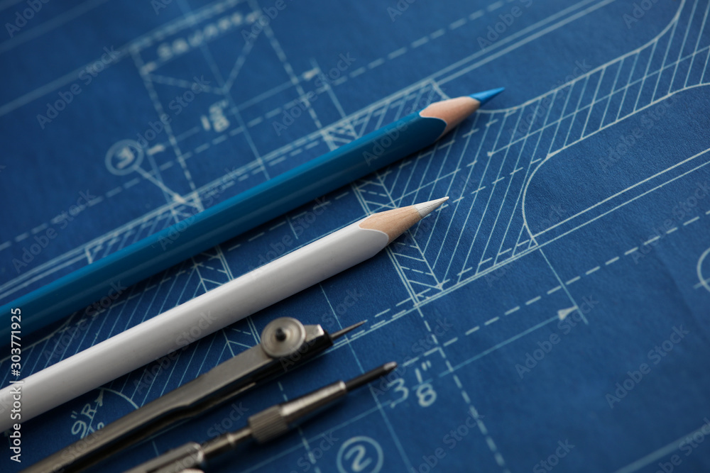 Φωτογραφία Drawing tools lying over blueprint paper