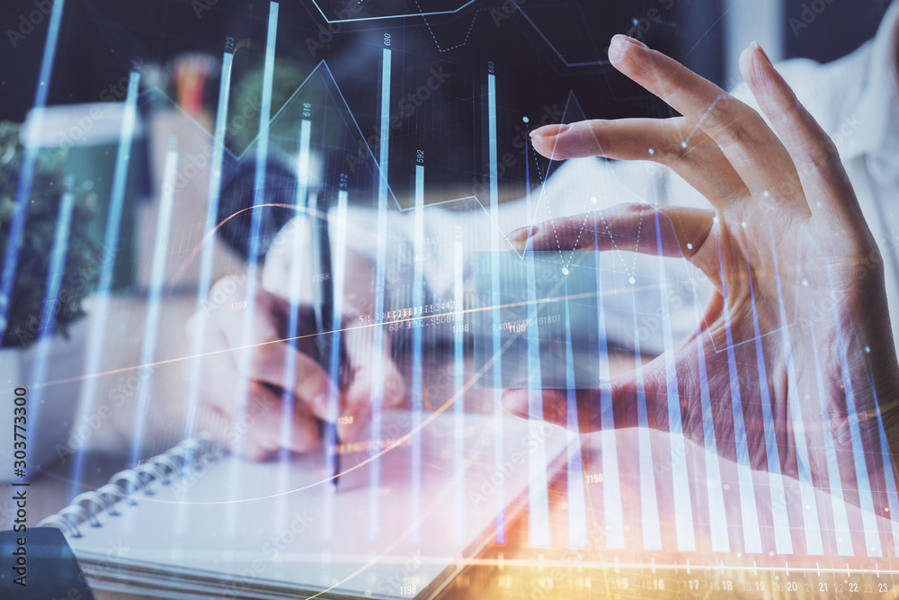Forex chart displayed on woman's hand taking notes background. Concept of research. Multi exposure Forex chart displayed on woman's hand taking notes background. Concept of research. Multi exposure