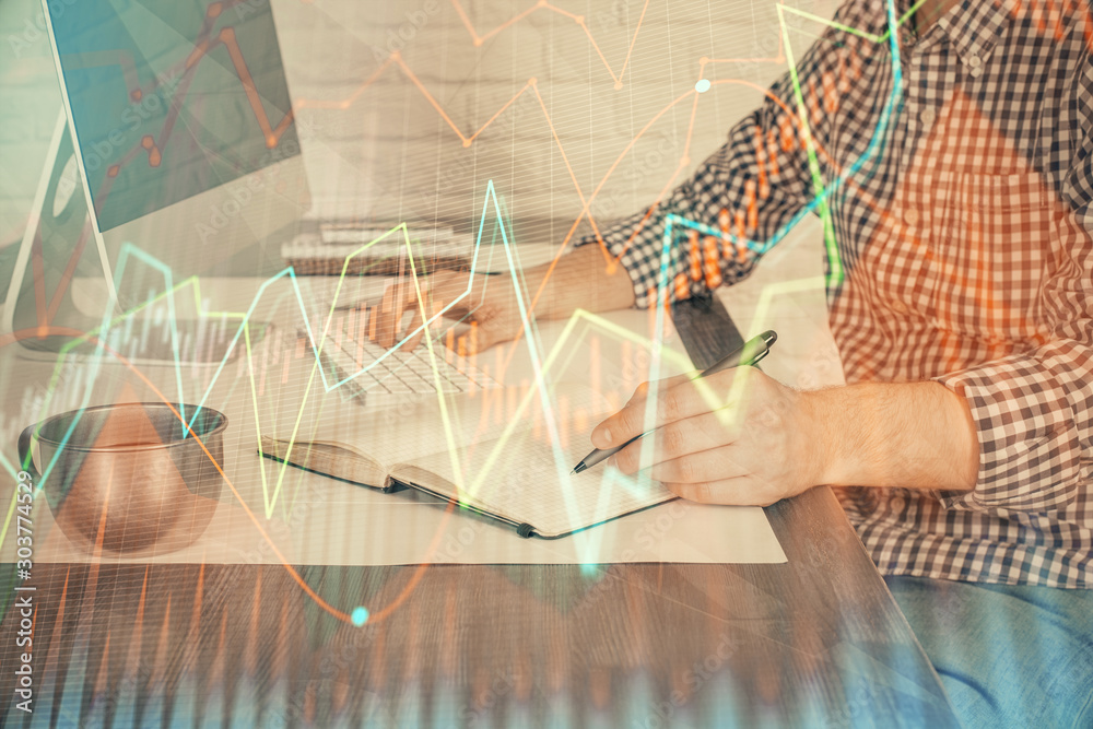 Double exposure of stock market chart with man working on computer on background. Concept of financial analysis. Double exposure of stock market chart with man working on computer on background. Concept of financial analysis.