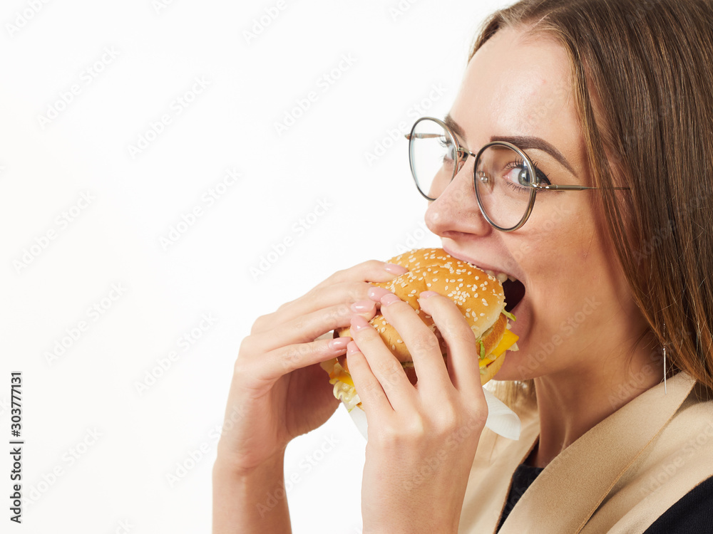 girl eating a burger on a white background girl eating a burger on a white background