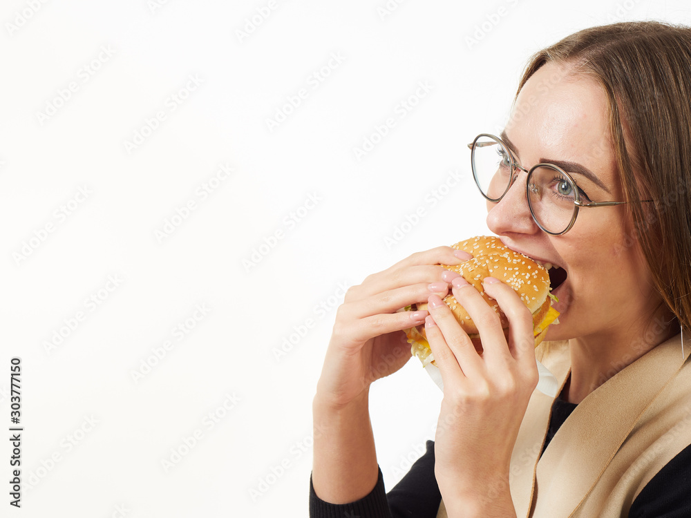 girl eating a burger on a white background girl eating a burger on a white background